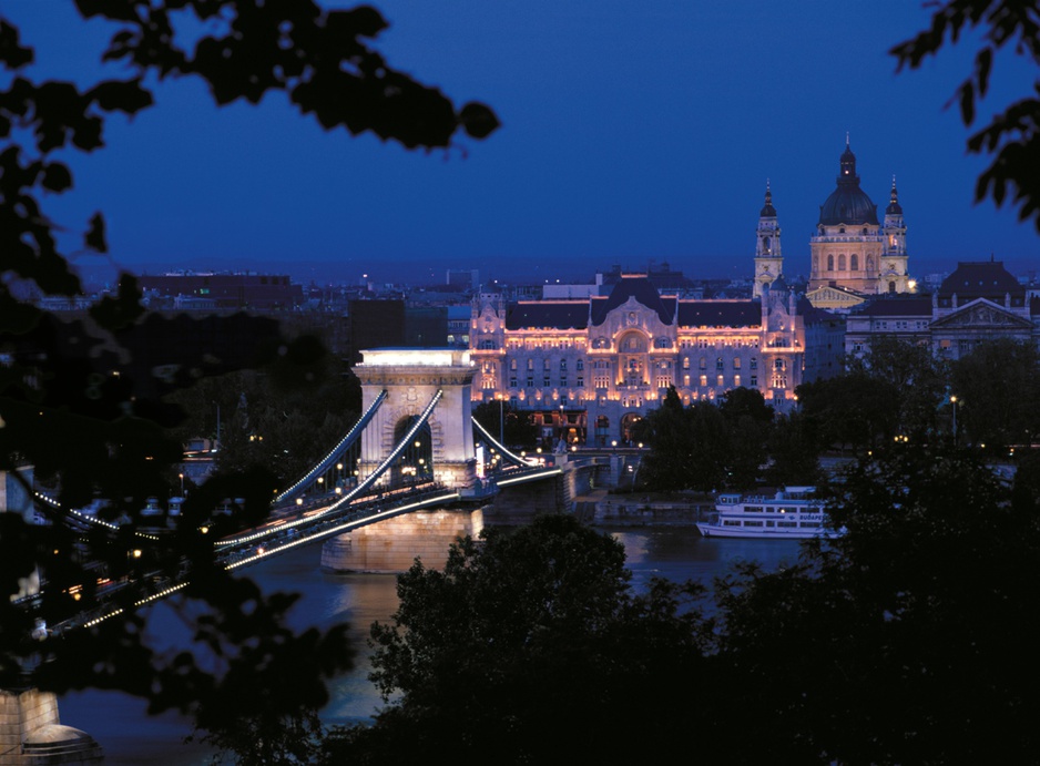 Budapest at night with the Chain Bridge lit up and the Four Seasons Hotel Gresham Palace in the background