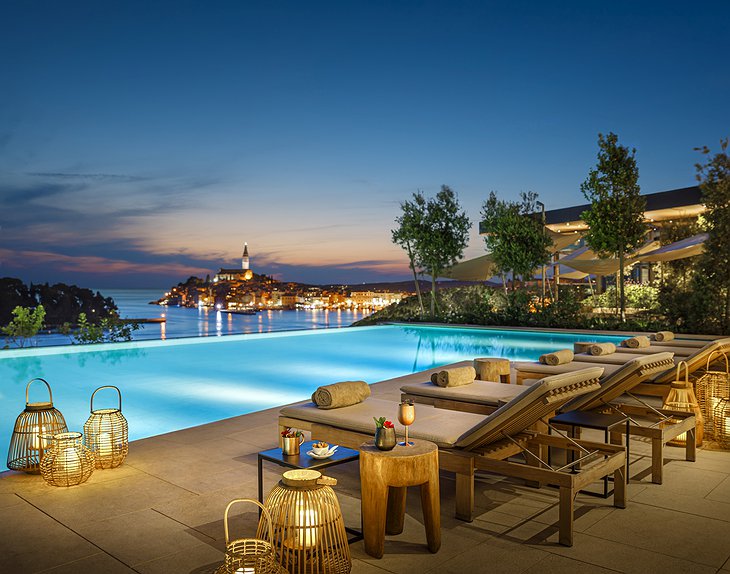 Grand Park Hotel Rovinj Outdoor Pool at Night With Sea & Old Town Panorama