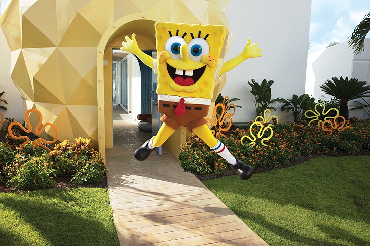 SpongeBob jumping in front of his Pineapple Villa