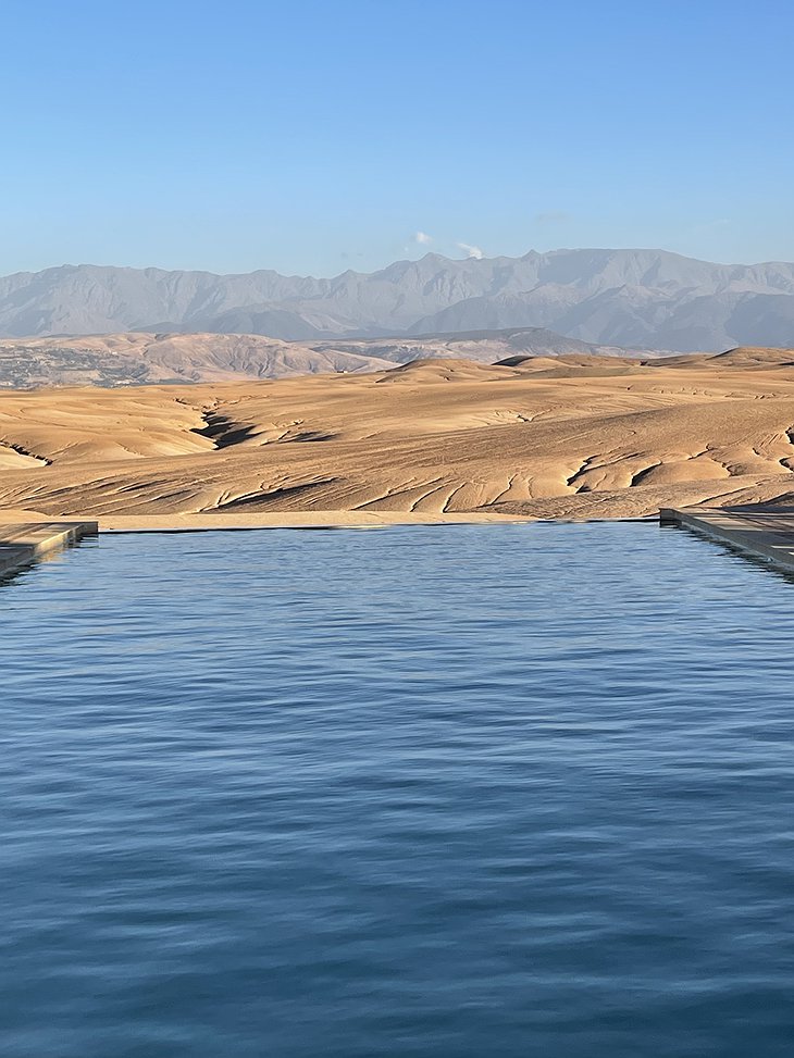 Le Circles restaurant pool with view of the Agafay Desert